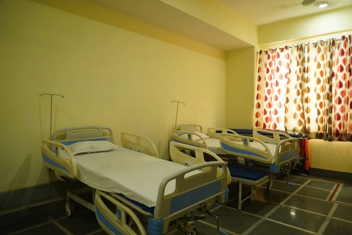 School infirmary with hospital beds and IV stands