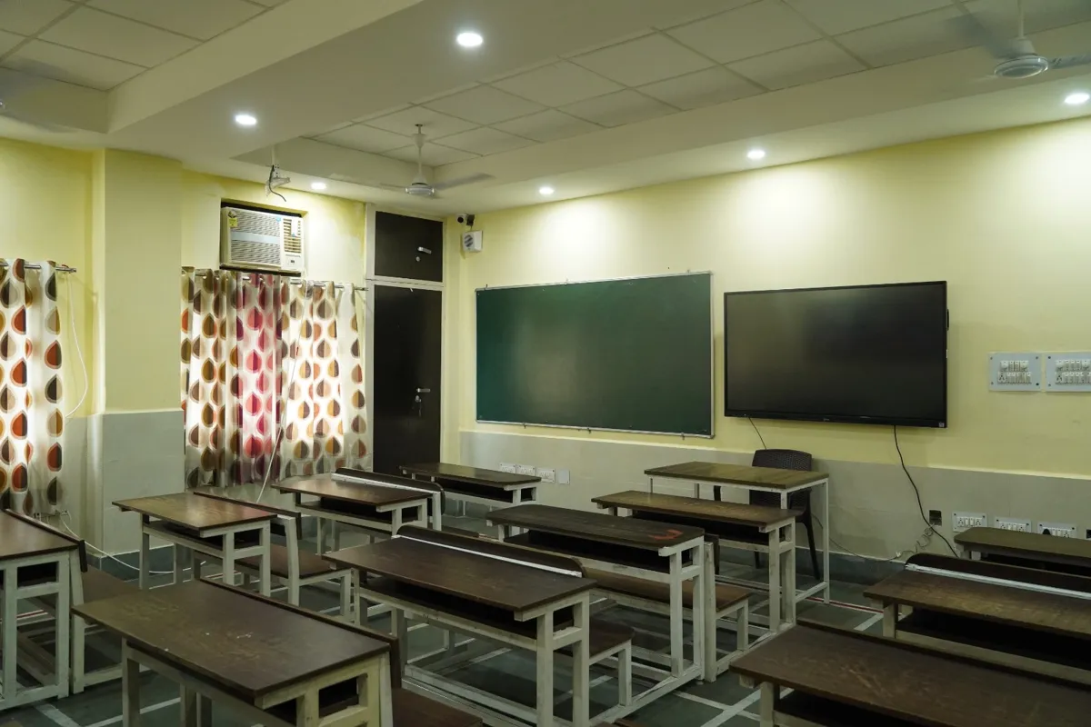 Smart classroom with a green board, an interactive display panel and wooden desks at SKS World School, Greater Noida West