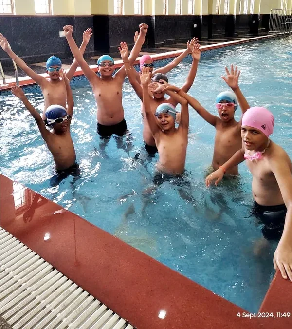 Students swimming in the school pool at SKS World School, Greater Noida West