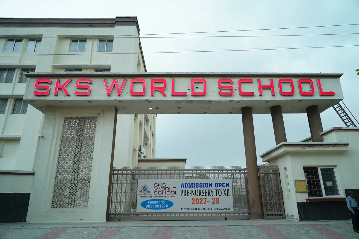 Main gate with the SKS World School sign and the admissions banner, SKS World School, Greater Noida West
