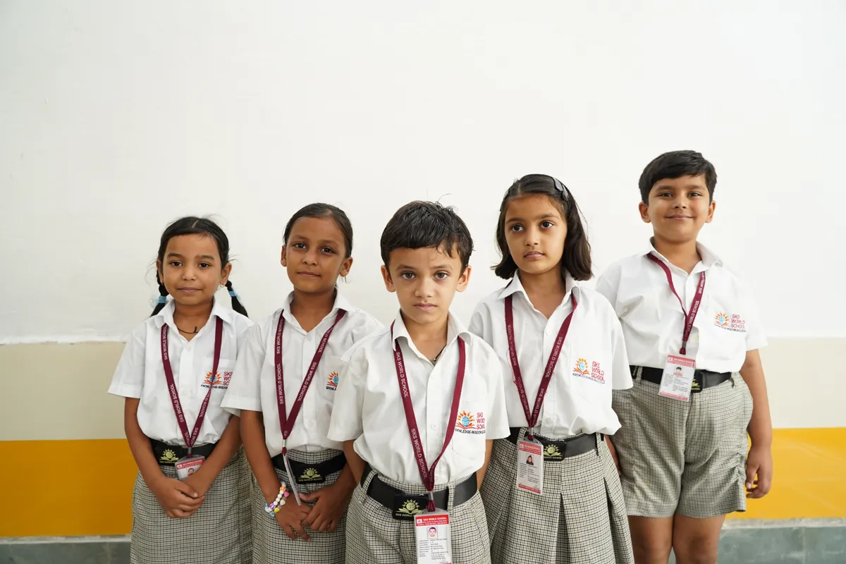 Primary students in school uniform with their ID cards, SKS World School, Greater Noida West