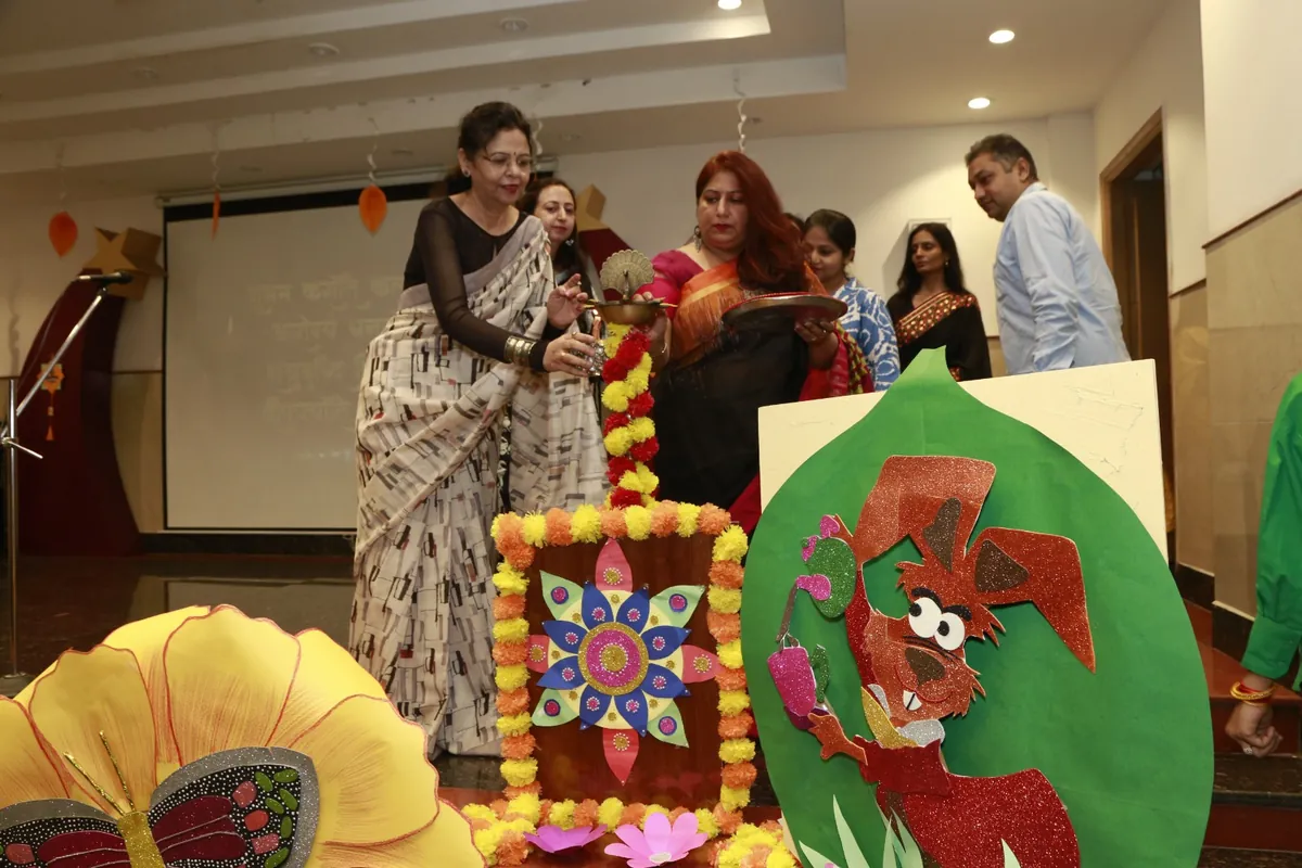 Guests lighting the ceremonial lamp at a school function at SKS World School, Greater Noida West
