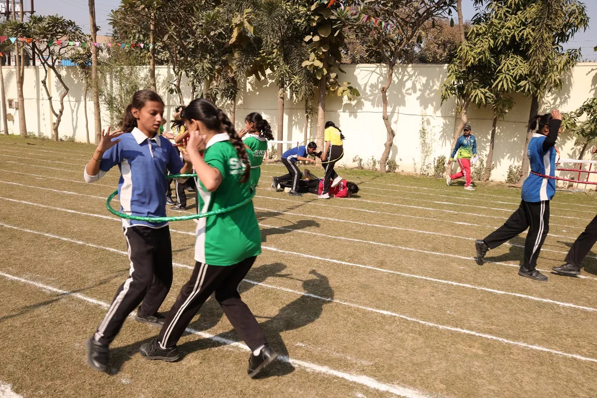 Students racing on the track on Sports Day at SKS World School, Greater Noida West