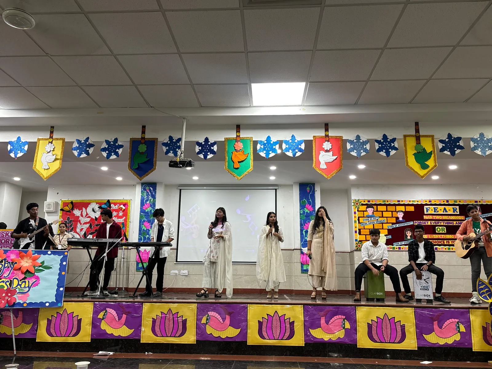 Student band with guitars, keyboards and cajons on stage at SKS World School, Greater Noida West