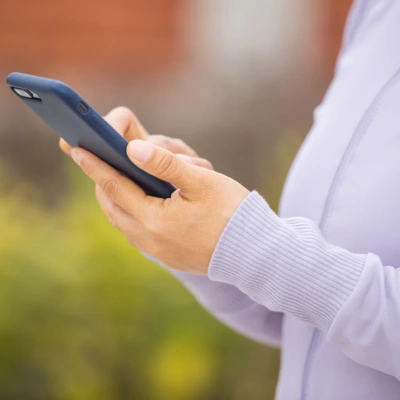 Parent checking school updates on a mobile phone